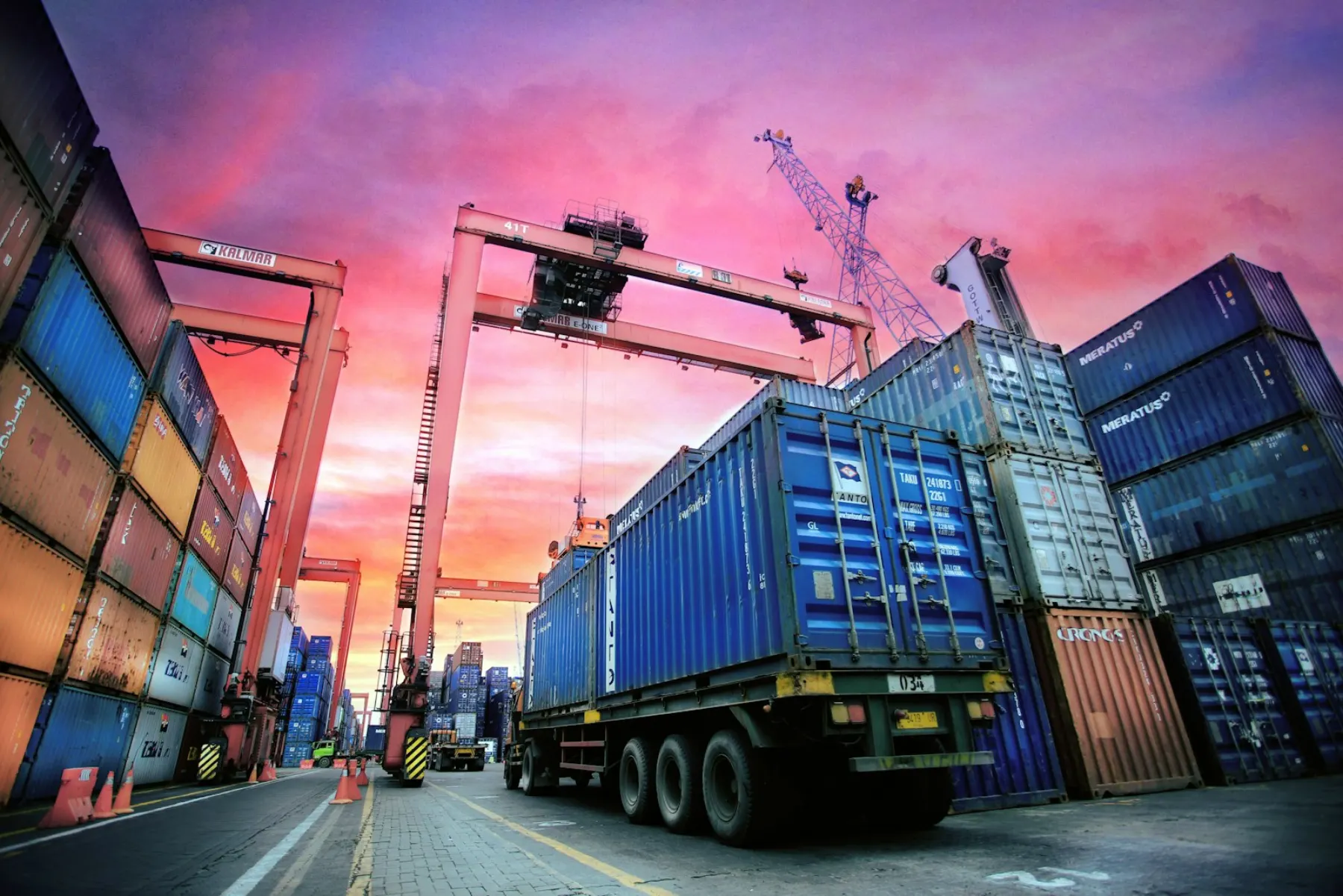 Containers being moved at port
